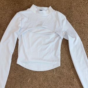 Light blue crop top with cut out on chest size XS never worn